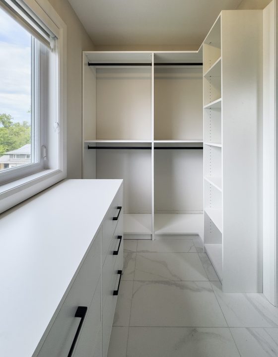 Custom reach-in closet design Toronto with white cabinetry and precision drawers - ClosetFitter Mission