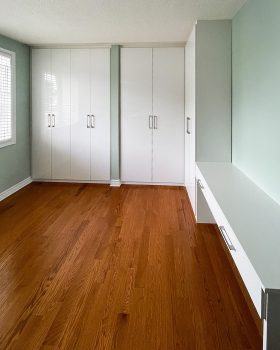 Minimalist built-in bedroom closet Toronto with custom shaker doors