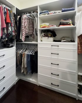 Organized custom closet system Toronto featuring double hanging rods and drawers